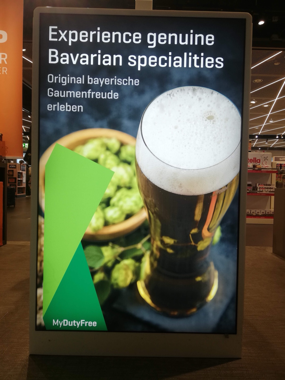 My beer-and-hops photograph on a MyDutyFree airport ad — 'Experience genuine Bavarian specialities'